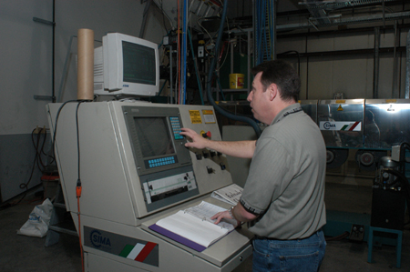 Operator at the computerized extrusion console at Polysteel